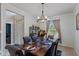 Elegant dining room with a wood table set for a formal dinner at 8336 Bent Oak Dr, Indianapolis, IN 46236