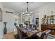 Inviting dining room with a well-set table and view into the living spaces at 8336 Bent Oak Dr, Indianapolis, IN 46236