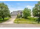 Beautiful two-story home with a well-maintained lawn and a driveway leading to the garage at 8336 Bent Oak Dr, Indianapolis, IN 46236