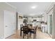 Eat-in kitchen with white cabinets, tile floors, and a table for casual dining at 8336 Bent Oak Dr, Indianapolis, IN 46236