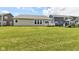 Backyard featuring lawn, back of home, and deck at 8864 Rowling Way, Indianapolis, IN 46239