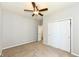 Bedroom with neutral walls, carpet, closet, and ceiling fan at 8864 Rowling Way, Indianapolis, IN 46239