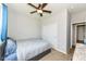 Bedroom featuring a ceiling fan, closet, and carpeted floors at 8864 Rowling Way, Indianapolis, IN 46239