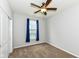 Bedroom featuring carpet, window with curtains, ceiling fan at 8864 Rowling Way, Indianapolis, IN 46239