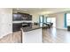 Stylish kitchen featuring granite counters and stainless appliances, with adjacent dining area at 8864 Rowling Way, Indianapolis, IN 46239