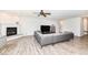 Bright living room featuring a fireplace, media center, and comfortable seating at 8864 Rowling Way, Indianapolis, IN 46239