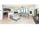 Open-concept living area with fireplace, kitchen, and dining, perfect for entertaining at 8864 Rowling Way, Indianapolis, IN 46239