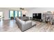 Spacious living room with a fireplace, ample natural light, and modern flooring at 8864 Rowling Way, Indianapolis, IN 46239