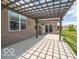 Spacious backyard patio with a pergola, seamlessly blending indoor-outdoor living and creating an inviting space at 8866 Twain Ln, Indianapolis, IN 46239