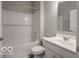Clean bathroom featuring a tub, a shower, and a modern sink at 8866 Twain Ln, Indianapolis, IN 46239