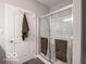 Modern bathroom featuring a glass-enclosed shower and a towel rack at 8866 Twain Ln, Indianapolis, IN 46239