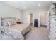 Cozy bedroom featuring a queen-sized bed, carpet flooring, and neutral-colored walls at 8866 Twain Ln, Indianapolis, IN 46239