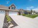 A row of homes with well-manicured lawns and inviting driveways provide a picturesque neighborhood setting at 8866 Twain Ln, Indianapolis, IN 46239