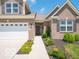 Inviting front entrance with a well-maintained walkway, landscaping, and a charming front door at 8866 Twain Ln, Indianapolis, IN 46239