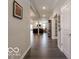 Spacious hallway featuring hardwood floors and an open view to the living area, creating a welcoming space at 8866 Twain Ln, Indianapolis, IN 46239