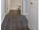 Hallway with wood floors leading to other rooms at 8866 Twain Ln, Indianapolis, IN 46239