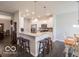 Modern kitchen featuring a breakfast bar with seating and stainless steel appliances at 8866 Twain Ln, Indianapolis, IN 46239