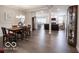 Open-concept living and dining area with hardwood floors, providing an ideal space for entertaining at 8866 Twain Ln, Indianapolis, IN 46239