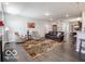 Comfortable living room with ample seating, natural light, and an inviting atmosphere, ideal for relaxation at 8866 Twain Ln, Indianapolis, IN 46239