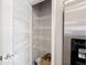Walk-in pantry with shelving for food storage next to stainless steel fridge at 8866 Twain Ln, Indianapolis, IN 46239