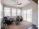 Bright sunroom with ample windows offering a serene view and comfortable seating for relaxation and enjoyment at 8866 Twain Ln, Indianapolis, IN 46239