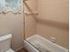 Bathroom with a tub and a toilet at 8923 Maze Rd, Indianapolis, IN 46259