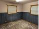 Carpeted bedroom with wainscotting and two windows at 8923 Maze Rd, Indianapolis, IN 46259
