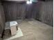 Spacious living room with carpet, panelled walls and ceiling, and heater at 8923 Maze Rd, Indianapolis, IN 46259