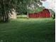 Outdoor view of two sheds on a lush, well-maintained lawn, offering ample storage space at 8923 Maze Rd, Indianapolis, IN 46259