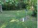 Landscaped lawn features an outdoor faucet with surrounding lush green grass and healthy shrubs at 8923 Maze Rd, Indianapolis, IN 46259