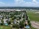 An aerial view of the neighborhood showcasing homes, lush trees and a pool at 901 Mallory Pkwy, Franklin, IN 46131