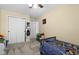 Charming bedroom with ample closet space, carpeted floors, and a ceiling fan, creating a fun and inviting space at 901 Mallory Pkwy, Franklin, IN 46131