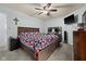 Well-appointed bedroom featuring a ceiling fan, desk area, and TV, creating a comfortable and functional living space at 901 Mallory Pkwy, Franklin, IN 46131