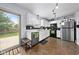 A galley kitchen features white cabinets and black appliances at 901 Mallory Pkwy, Franklin, IN 46131