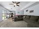 Open floor plan seamlessly connects the living room and kitchen, creating a spacious and inviting atmosphere for gatherings at 901 Mallory Pkwy, Franklin, IN 46131