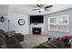 Cozy living room features a fireplace, large screen TV, and comfortable seating, perfect for relaxing and entertaining at 901 Mallory Pkwy, Franklin, IN 46131