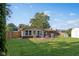 Green backyard featuring a wood deck, outdoor grill, outdoor seating and a playset at 911 Glendale Dr, Lebanon, IN 46052