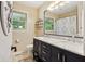 Bathroom featuring a double sink vanity, marble countertop and modern fixtures at 911 Glendale Dr, Lebanon, IN 46052