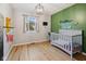 Bedroom with hardwood floors, natural light, and a playful design at 911 Glendale Dr, Lebanon, IN 46052