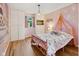 A whimsical bedroom featuring a pink canopy bed and ample closet space at 911 Glendale Dr, Lebanon, IN 46052