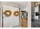 Inviting entryway featuring a view to the dining area, and decorative wreaths on the sliding doors at 911 Glendale Dr, Lebanon, IN 46052