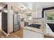 Updated kitchen with stainless steel appliances and granite countertops at 911 Glendale Dr, Lebanon, IN 46052