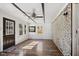 Sunroom features hardwood floors, exposed ceiling beams, a brick wall and lots of natural light at 911 Glendale Dr, Lebanon, IN 46052