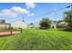 Expansive backyard with a well-kept lawn, offering plenty of space for outdoor activities at 95 S 11Th Ave, Beech Grove, IN 46107