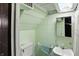 A modest basement bathroom with a basic sink, toilet, and shower at 95 S 11Th Ave, Beech Grove, IN 46107