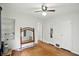 Bright bedroom with hardwood floors and ample space, with open shelving and natural light at 95 S 11Th Ave, Beech Grove, IN 46107