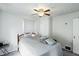 This bedroom features a ceiling fan, window with blinds, and neutral decor at 95 S 11Th Ave, Beech Grove, IN 46107
