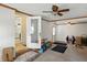 Bonus room featuring carpet flooring, multiple doors, and ceiling fans at 95 S 11Th Ave, Beech Grove, IN 46107