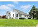 A well-maintained lawn, updated siding, and lush landscaping accentuate this home's exterior at 95 S 11Th Ave, Beech Grove, IN 46107