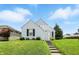 Charming one-story home with manicured lawn and inviting curb appeal under a clear blue sky at 95 S 11Th Ave, Beech Grove, IN 46107